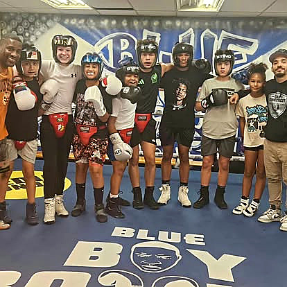 Blue Boy youth boxers standing in the club ring